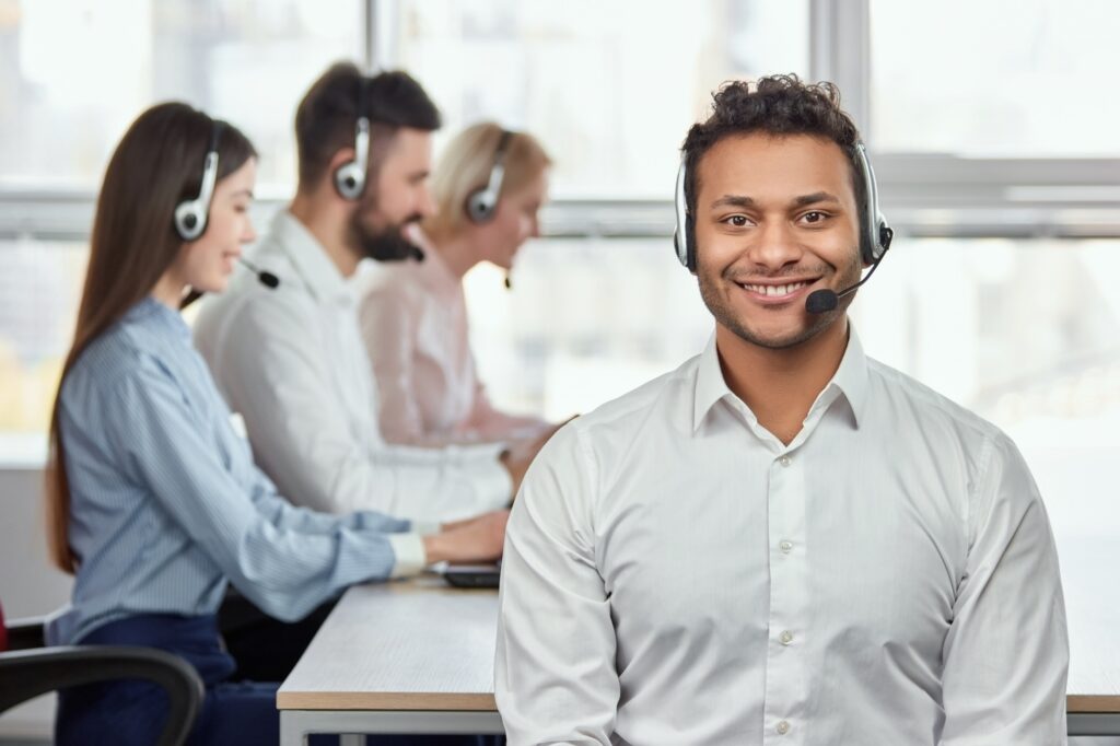 Young friendly male customer service operator.